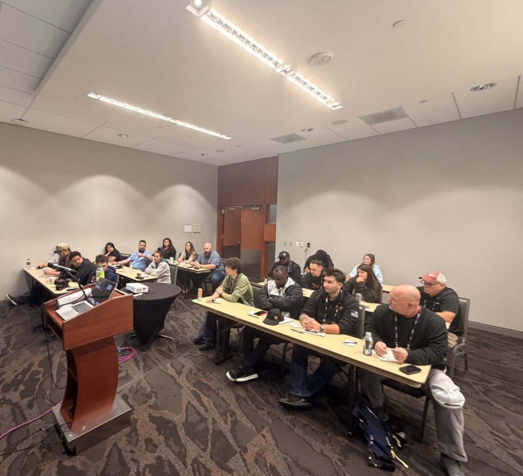 A full room of shop owners seated at tables listening to a presenter during a session at ASTA Expo 2026